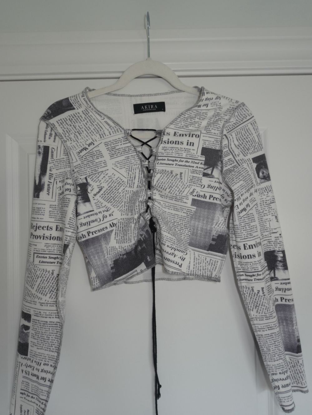 AKIRA Black & White Newspaper-Print Lace-Up Long Sleeve Crop Top